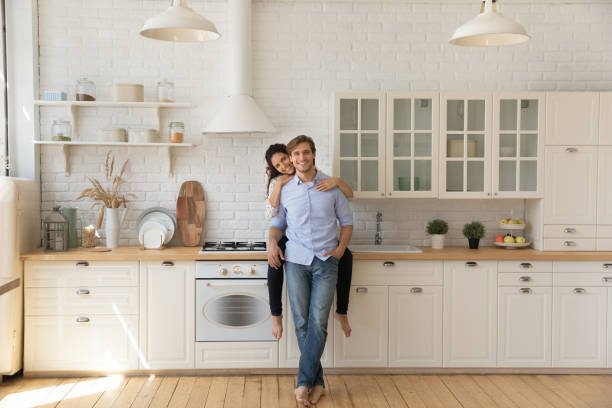 Homeowners in their finished kitchen